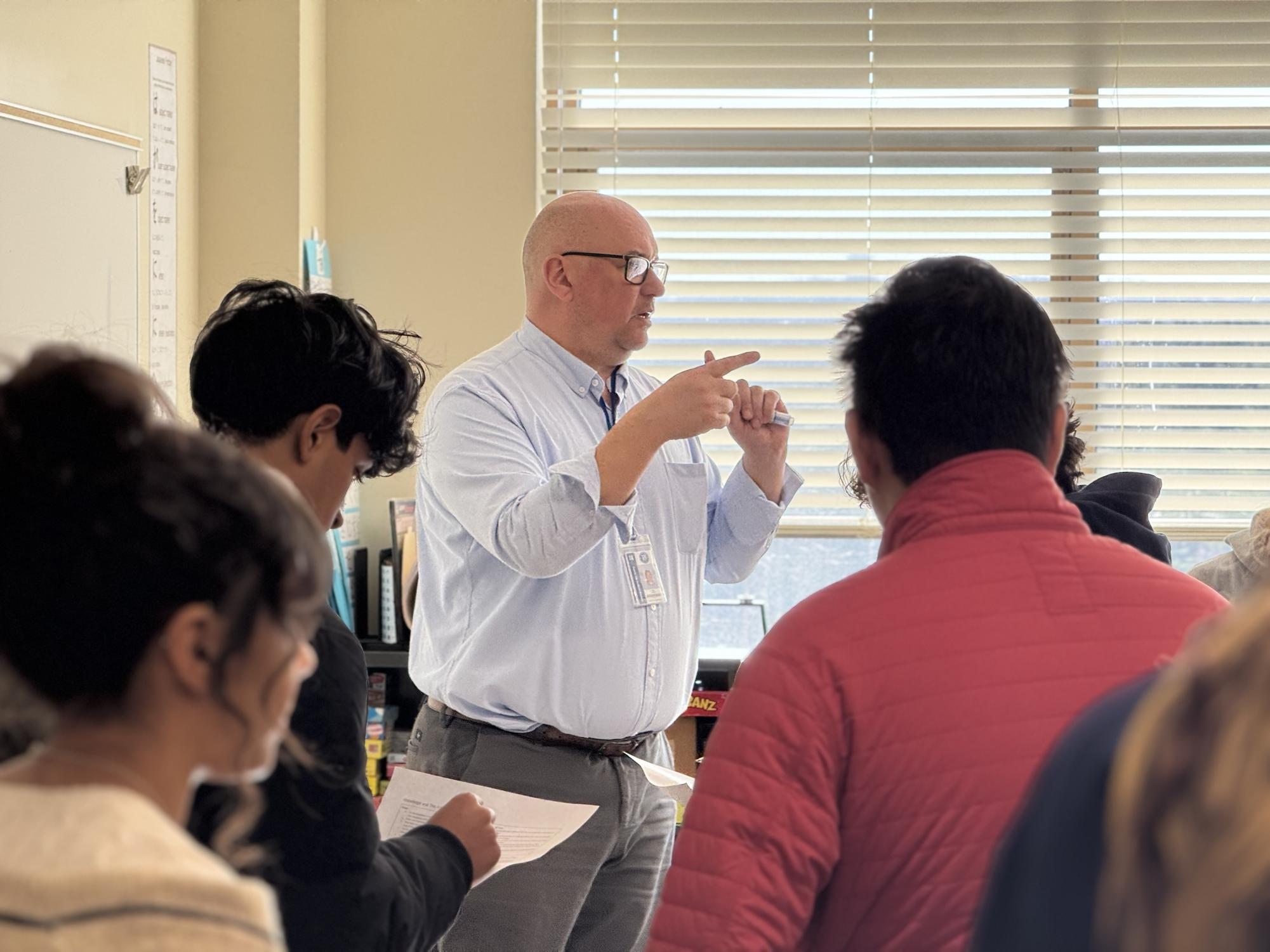 IB MYP and DP Coordinator Mark Childs leads class. 