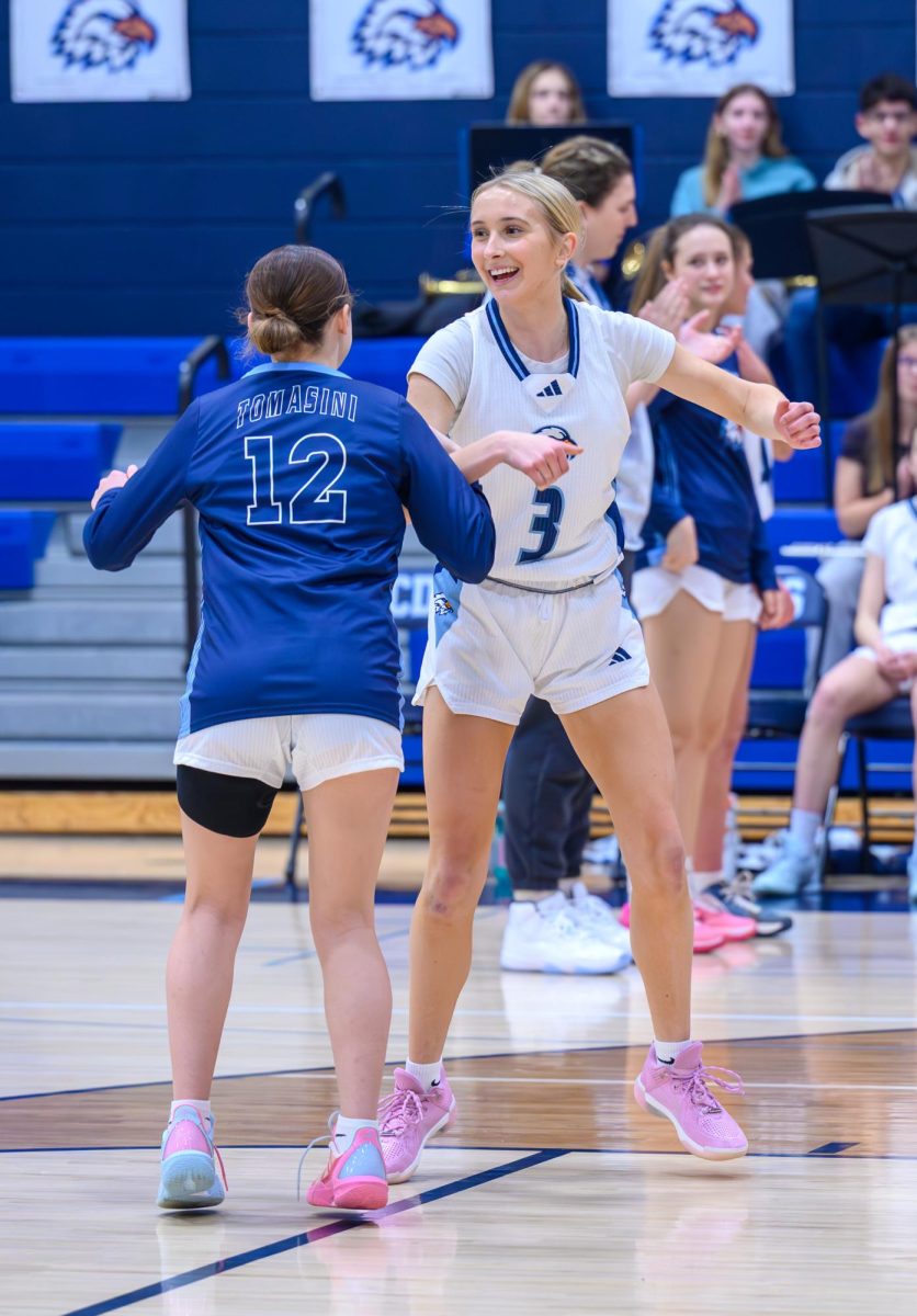 Ashlyn '28 and Zaida '28 cheer each other on for success.