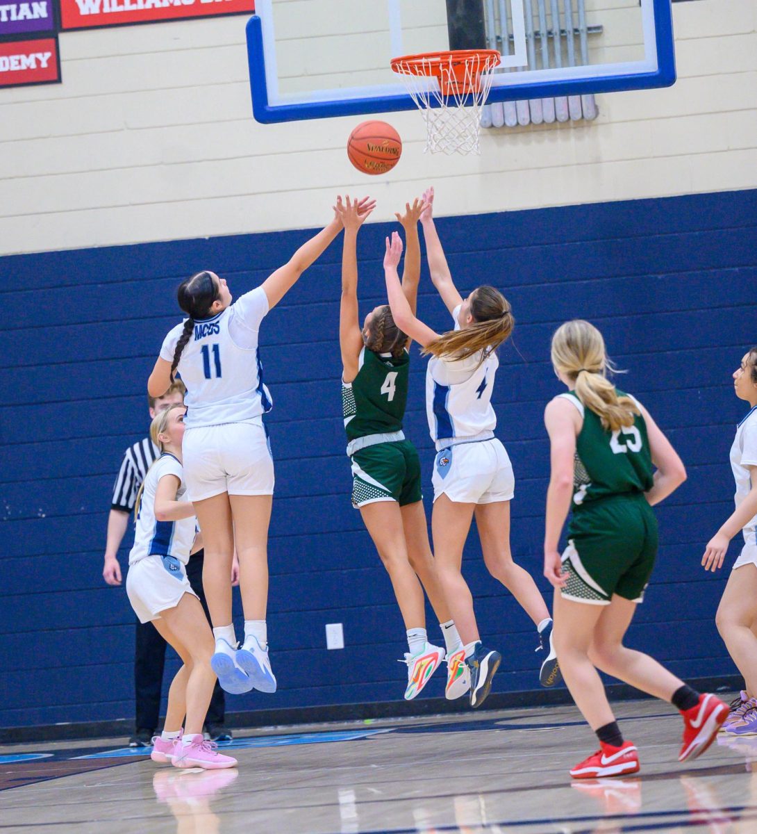 Zami '28 and Zara '29 go for the rebound.